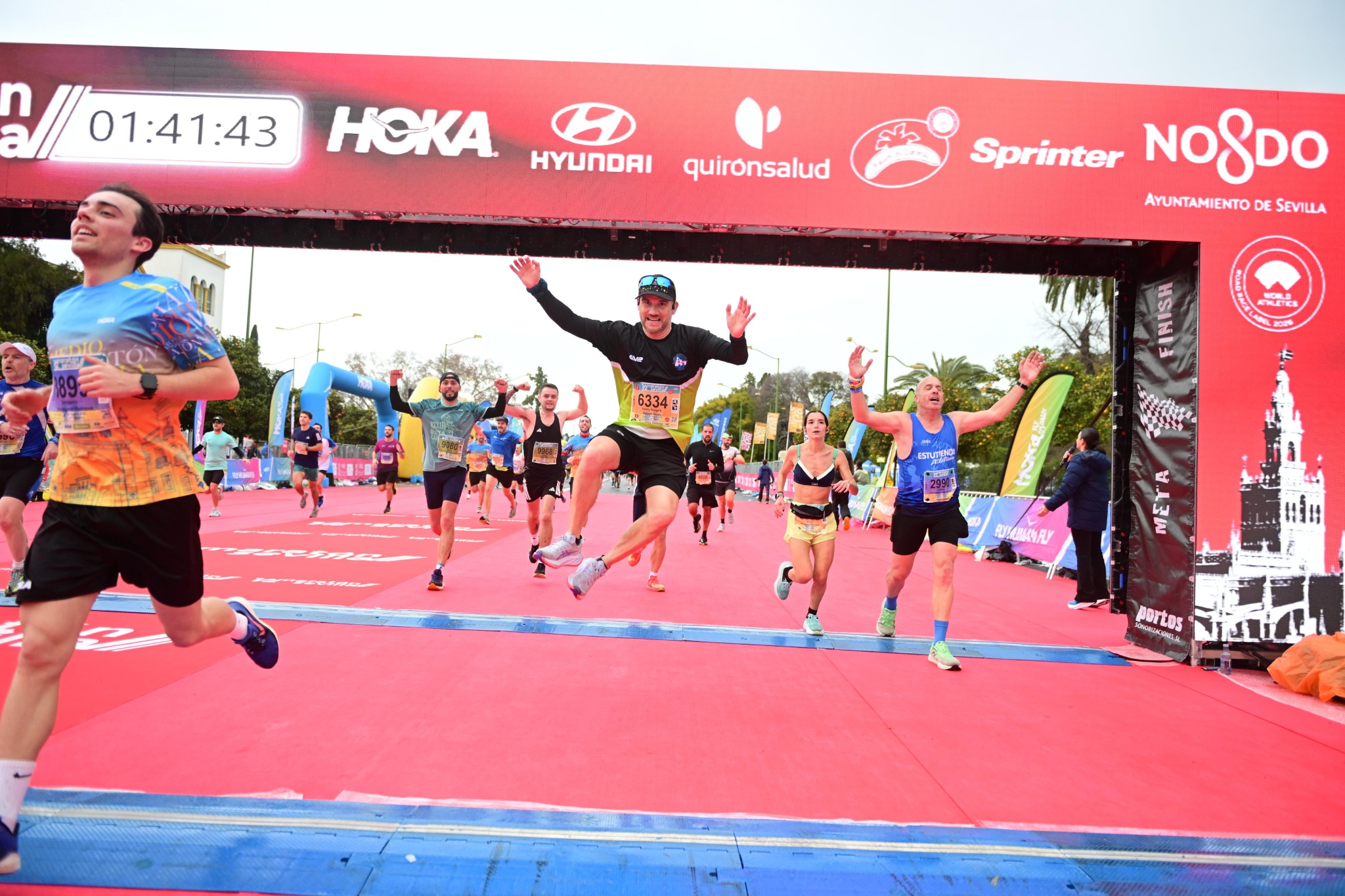 Ross McNaughton crossing the finish line at the Seville Half Marathon